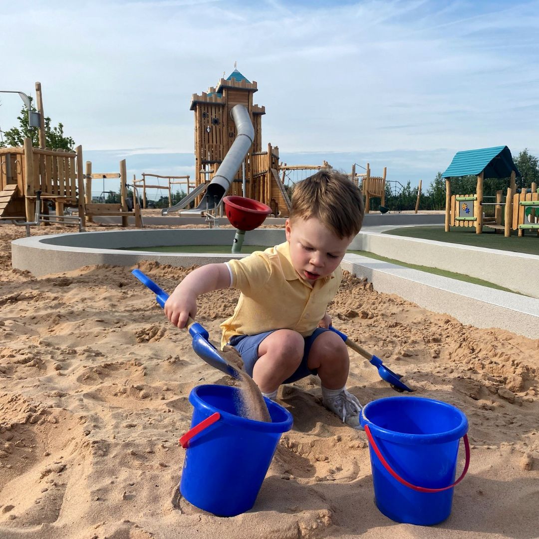 A child play in the sand zone at Fun Arium